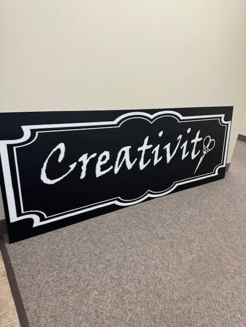 Dimensional sign for a creative business