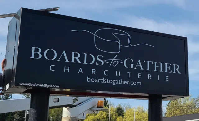 Illuminated cabinet sign for a charcuterie shop