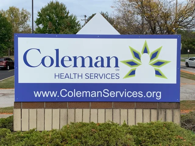 Illuminated monument sign for a health services provider