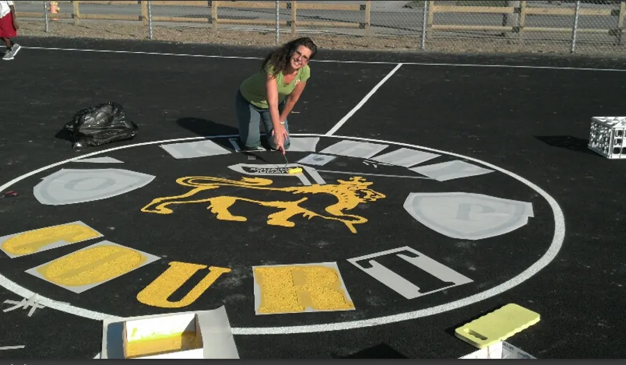 Custom asphalt court logo painting by DC Graphics